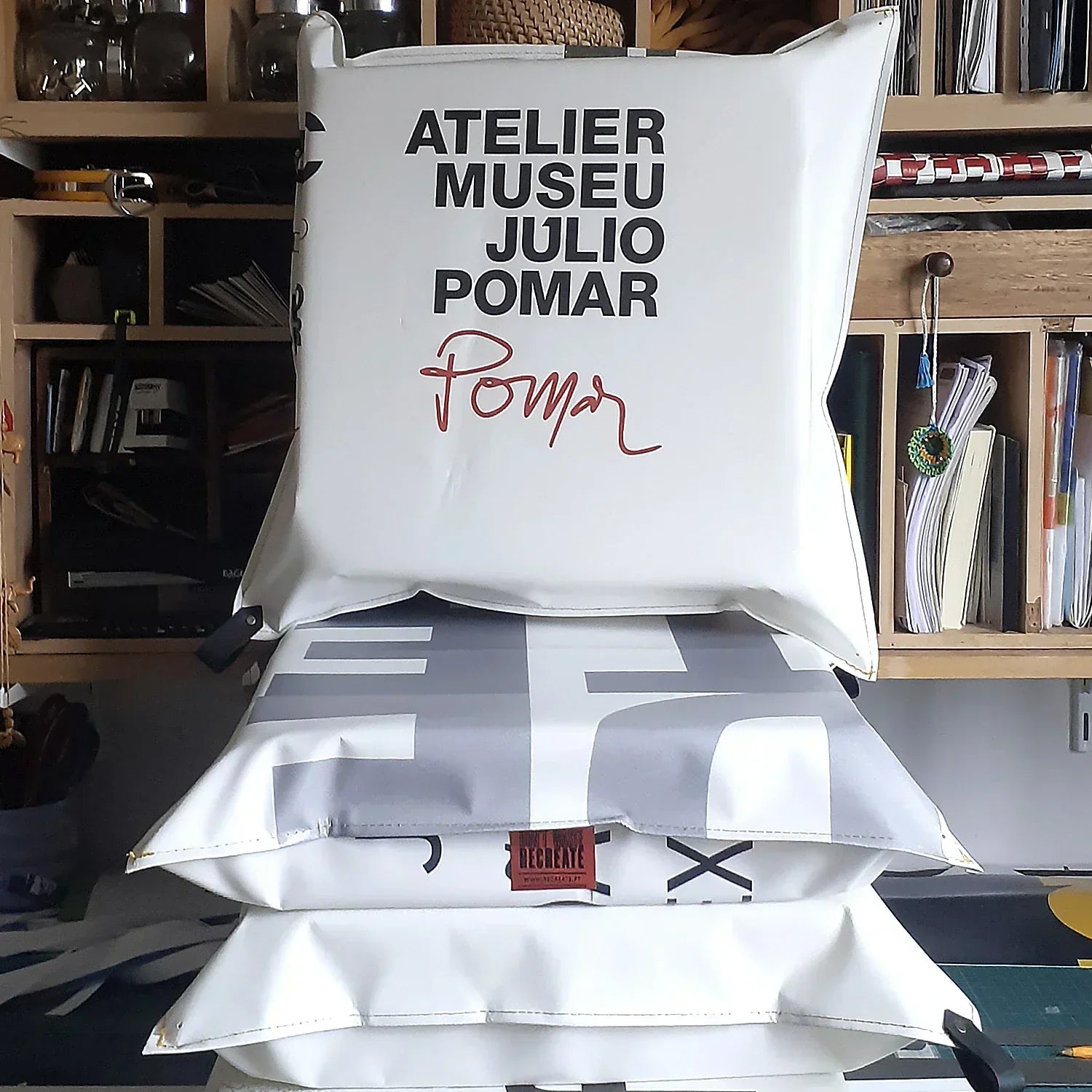 ReCreate transforms reclaimed advertising banners into unique cushions for Atelier-Museu Júlio Pomar, connecting design, comfort and material memory.