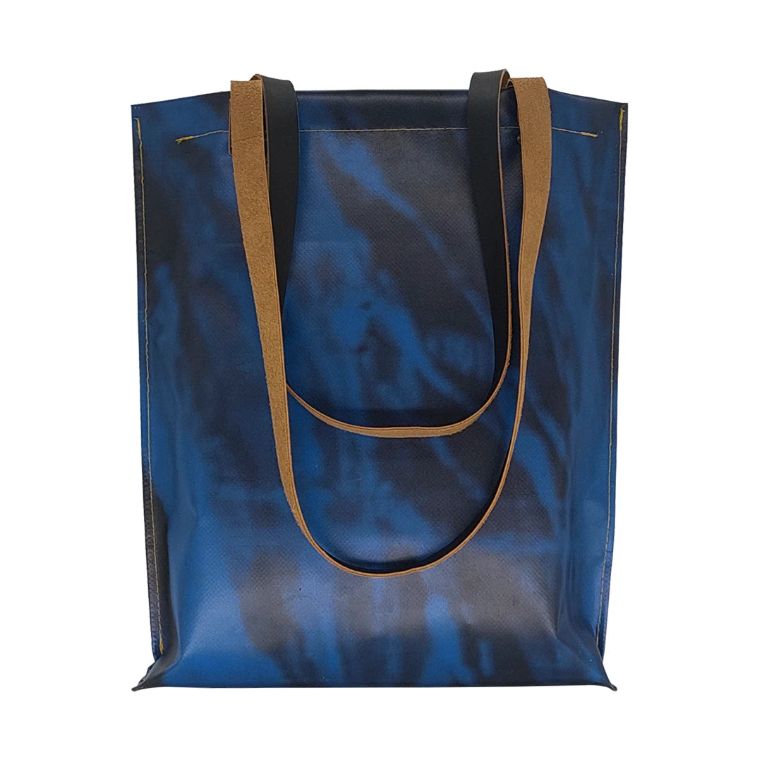 Handmade blue Alex bag from reclaimed advertising banner material, with leather handles and one interior pocket. Unique and numbered. - front