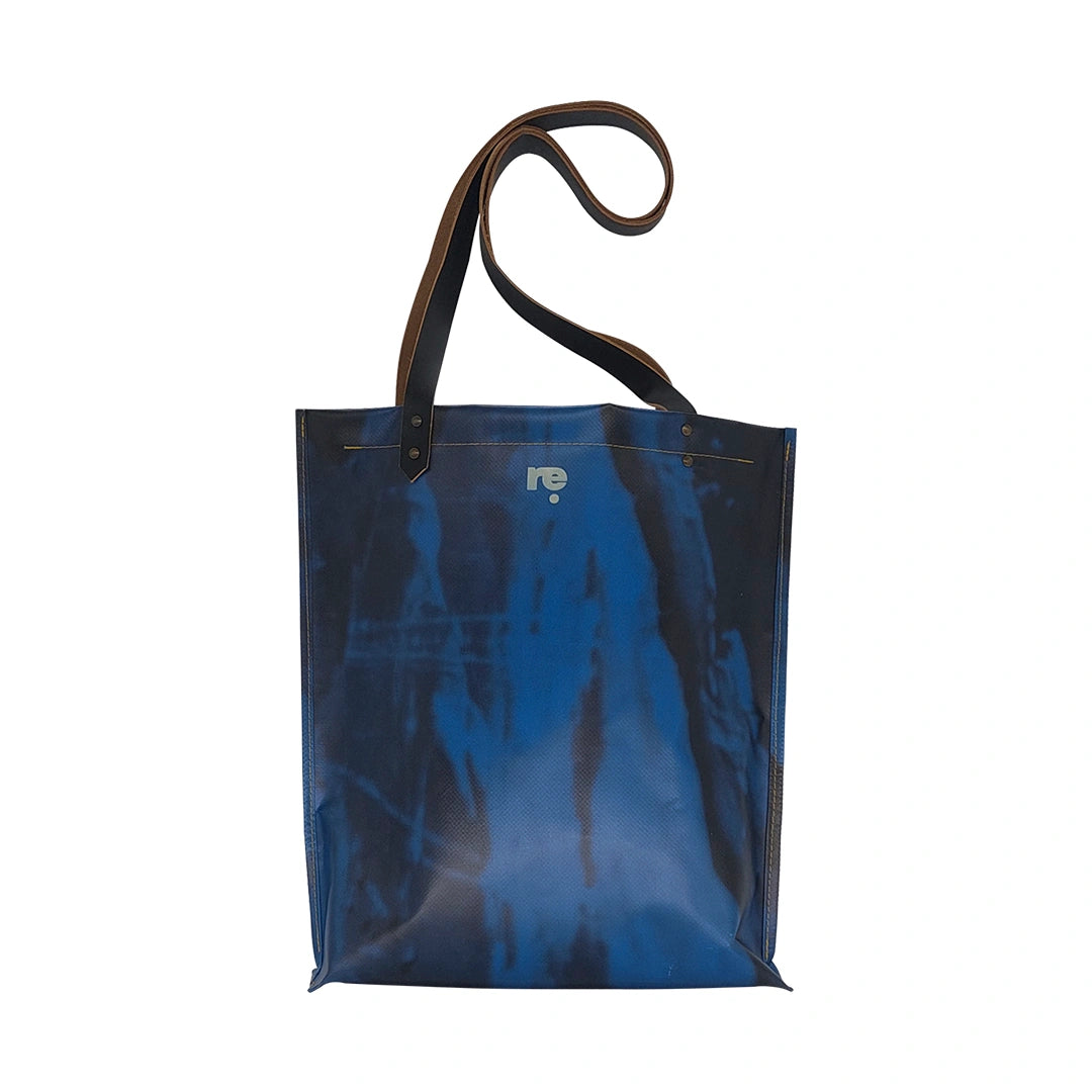 Handmade blue Alex bag from reclaimed advertising banner material, with leather handles and one interior pocket. Unique and numbered. - back