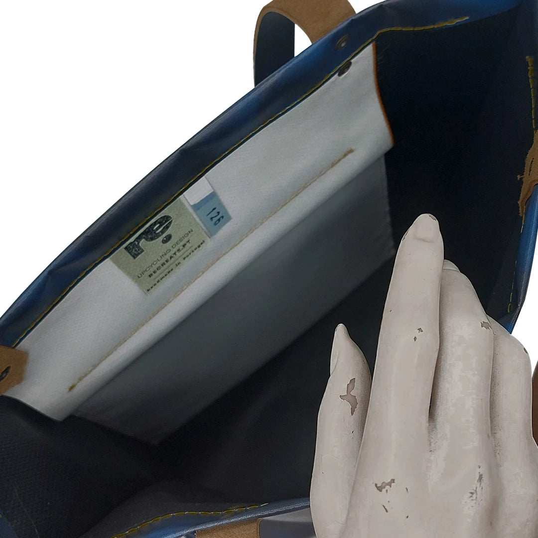 Handmade blue Alex bag from reclaimed advertising banner material, with leather handles and one interior pocket. Unique and numbered.  - inside pocket