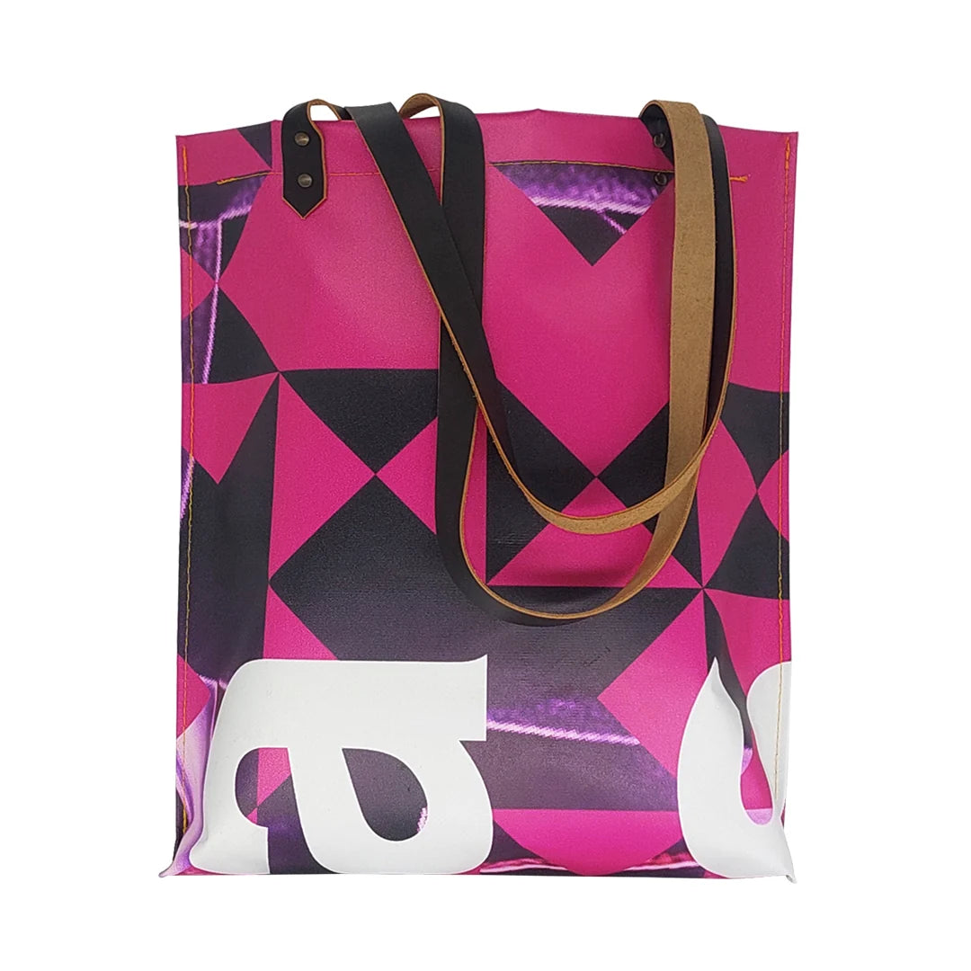 Graphic tote bag handmade from reclaimed banner material, with leather handles and an interior pocket. Unique, numbered and made in Lisbon. - front