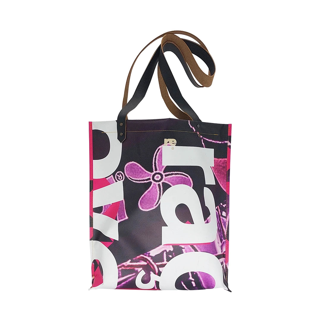 Graphic tote bag handmade from reclaimed banner material, with leather handles and an interior pocket. Unique, numbered and made in Lisbon. - back