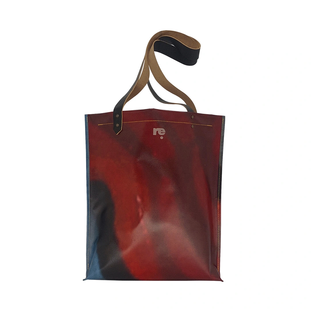 Unique handmade bag made from reclaimed advertising banner, with leather handles and an interior pocket. A numbered ReCreate piece crafted in Lisbon. - back