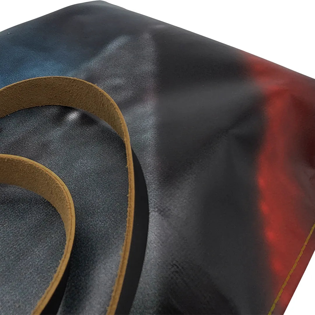 Unique handmade bag made from reclaimed advertising banner, with leather handles and an interior pocket. A numbered ReCreate piece crafted in Lisbon. - detail