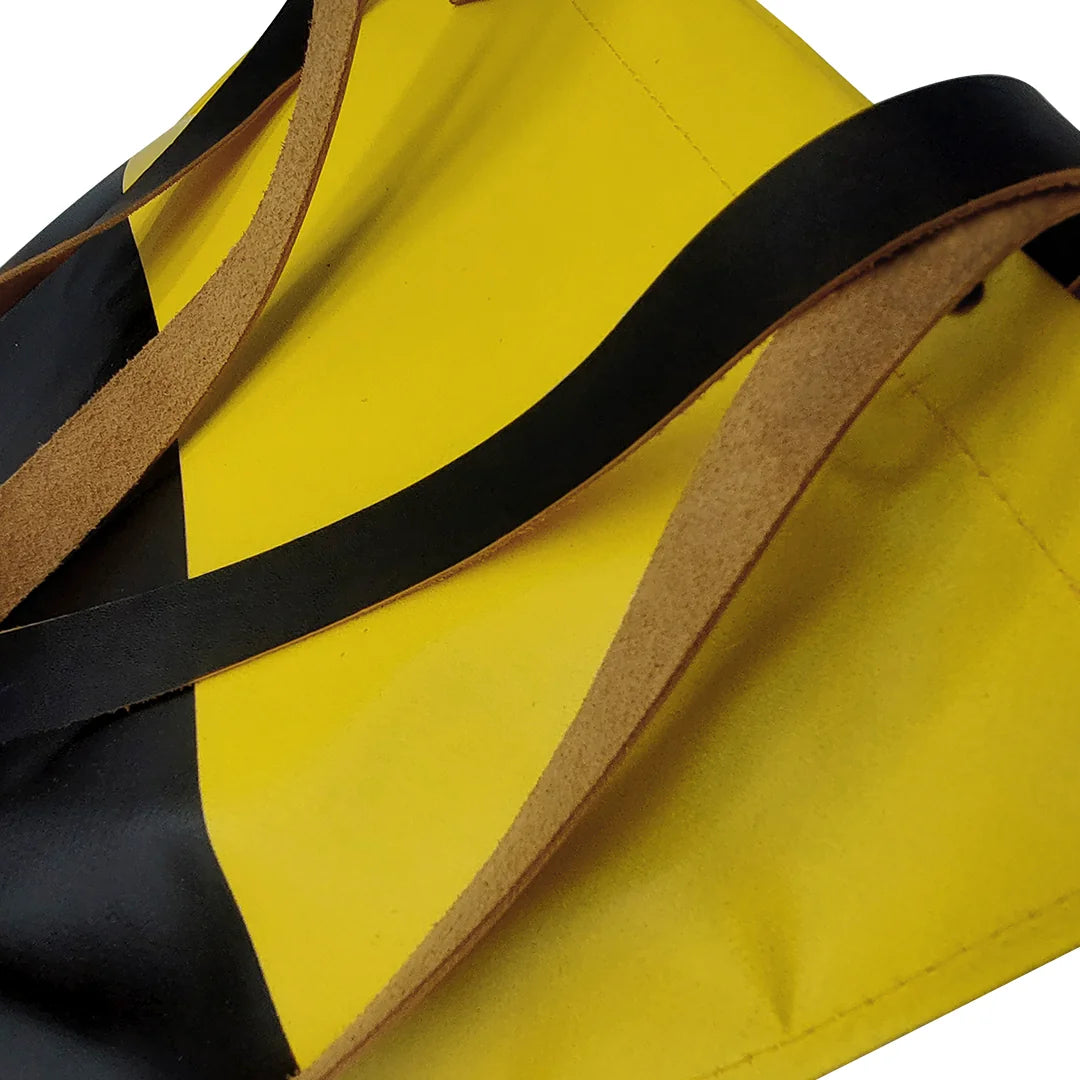 One-of-a-kind yellow and black handmade bag in reclaimed advertising banner, with leather handles and an inside pocket. Numbered ReCreate piece. - detail