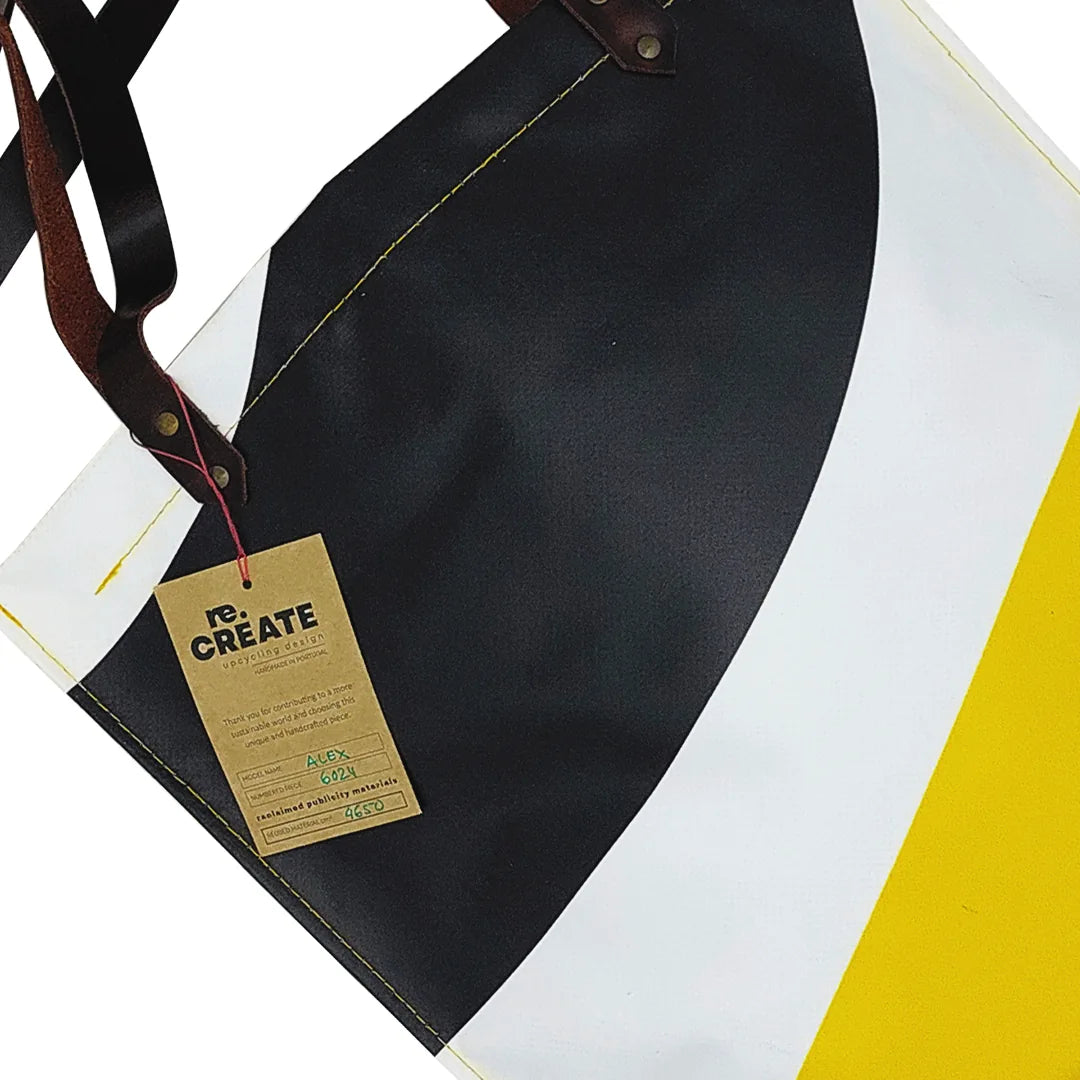 Alex Bag 6024 by ReCreate, a yellow tote in reclaimed advertising banner with leather straps and one inner pocket. - tag