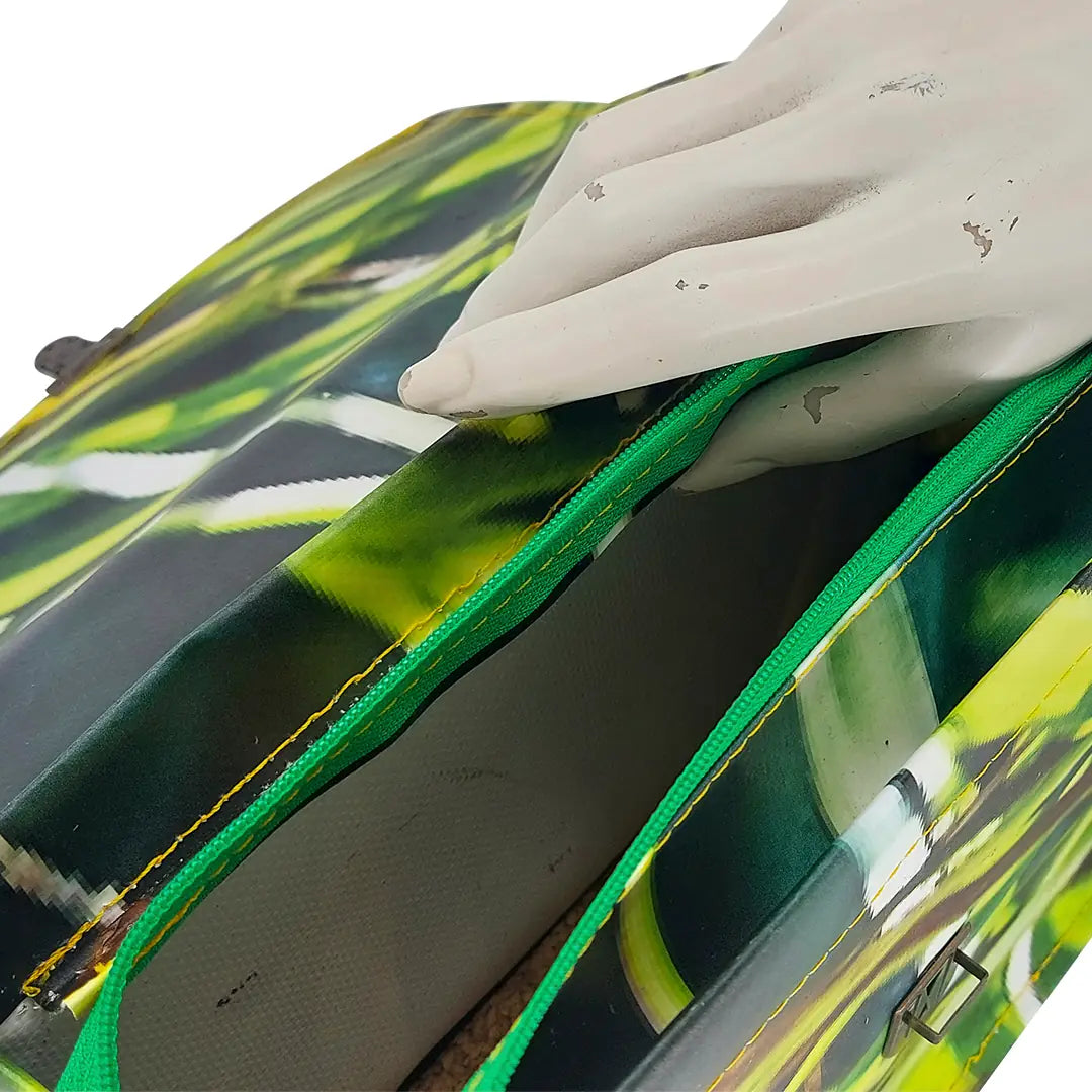 Alice Bag 126 by ReCreate, a structured bag in reclaimed advertising banner with green graphic movement and leather strap. - zipper