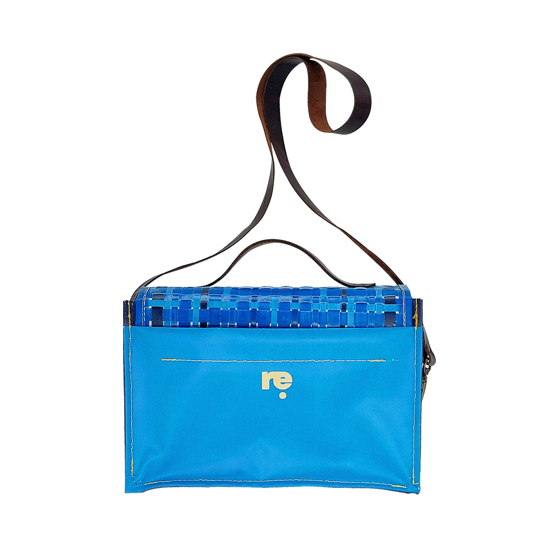 Alice Special Edition Bag 126 by ReCreate, a blue structured bag in reclaimed advertising banner with woven flap and leather strap. - back