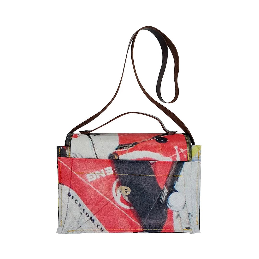Alice Bag 224 by ReCreate, a structured bag in reclaimed advertising banner with red graphic fragments, leather strap and yellow zip. -back
