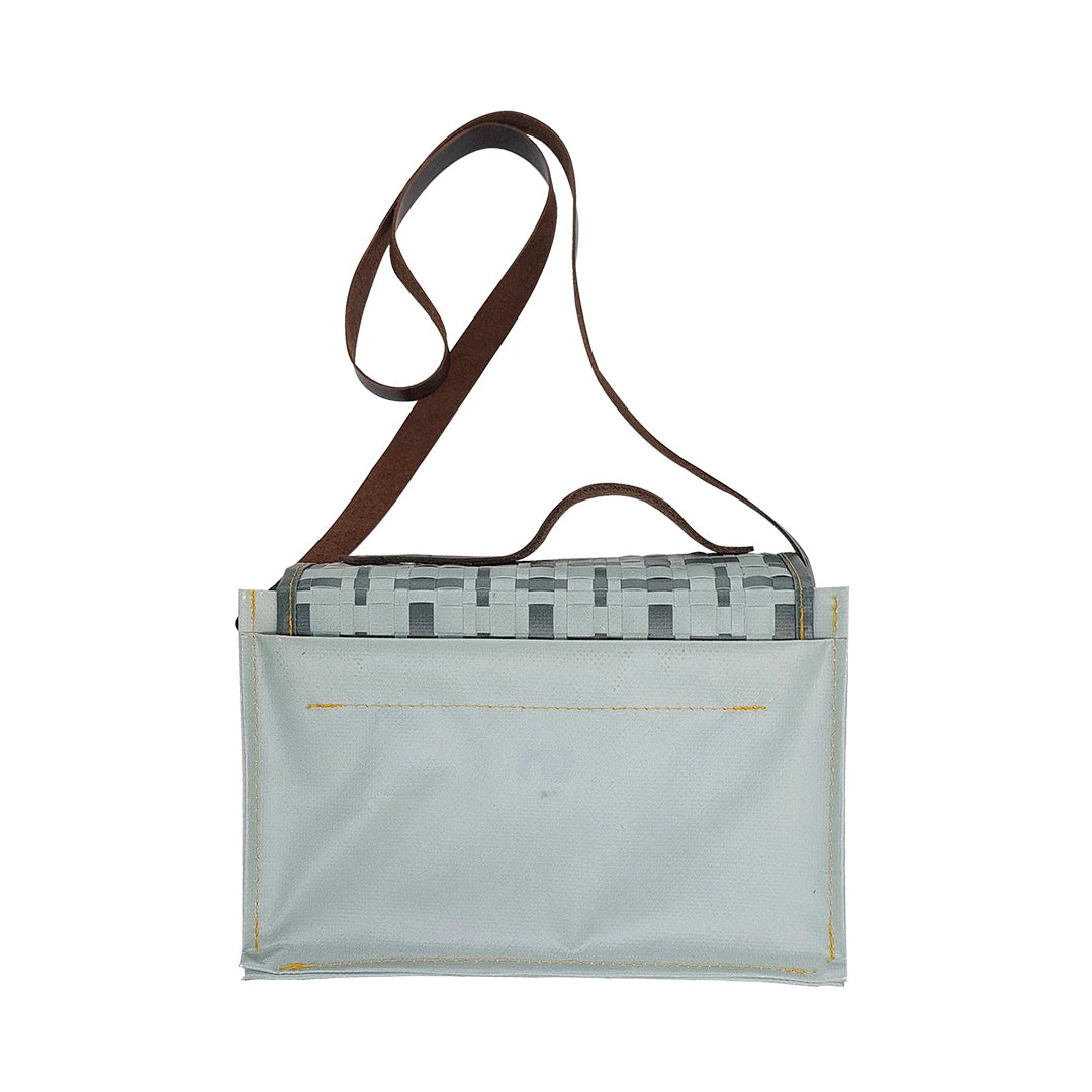Alice Special Edition Bag 224 by ReCreate, a grey special edition bag in reclaimed advertising banner with woven flap and leather strap. - back