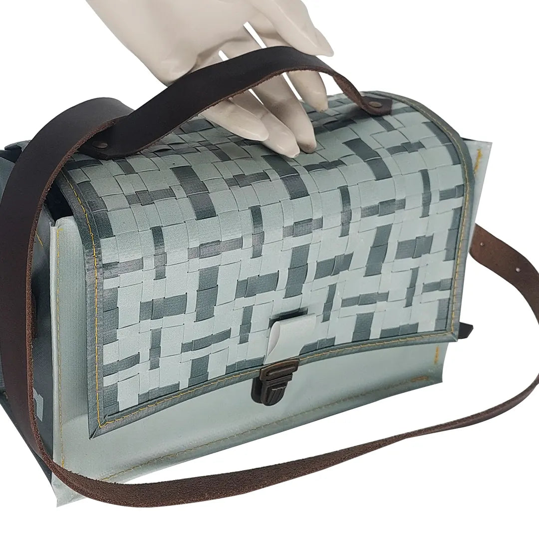 Alice Special Edition Bag 224 by ReCreate, a grey special edition bag in reclaimed advertising banner with woven flap and leather strap. - detail