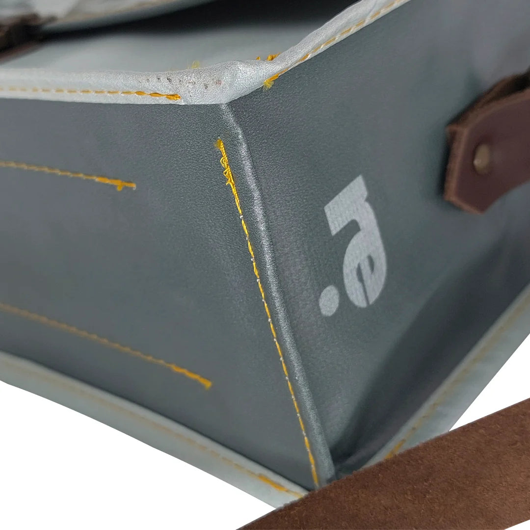 Alice Special Edition Bag 224 by ReCreate, a grey special edition bag in reclaimed advertising banner with woven flap and leather strap. - detail 2