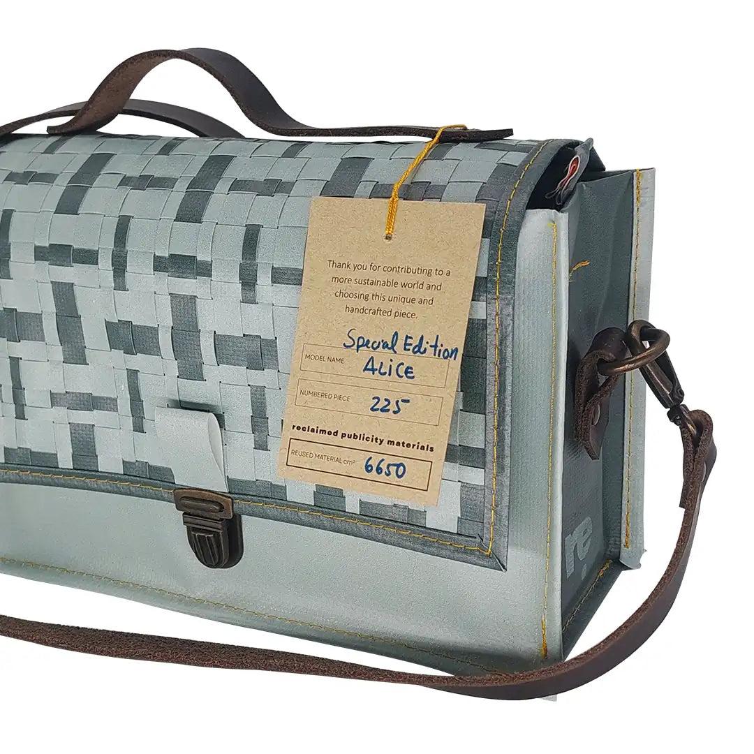 Alice Special Edition Bag 224 by ReCreate, a grey special edition bag in reclaimed advertising banner with woven flap and leather strap. -tag