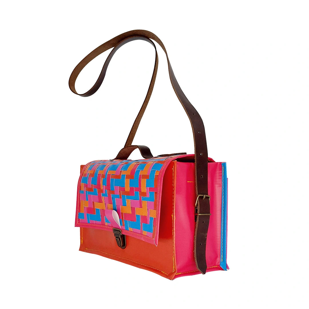 Alice Special Edition Bag 625 by ReCreate, a vibrant special edition bag in reclaimed advertising banner with woven flap and leather strap. - side