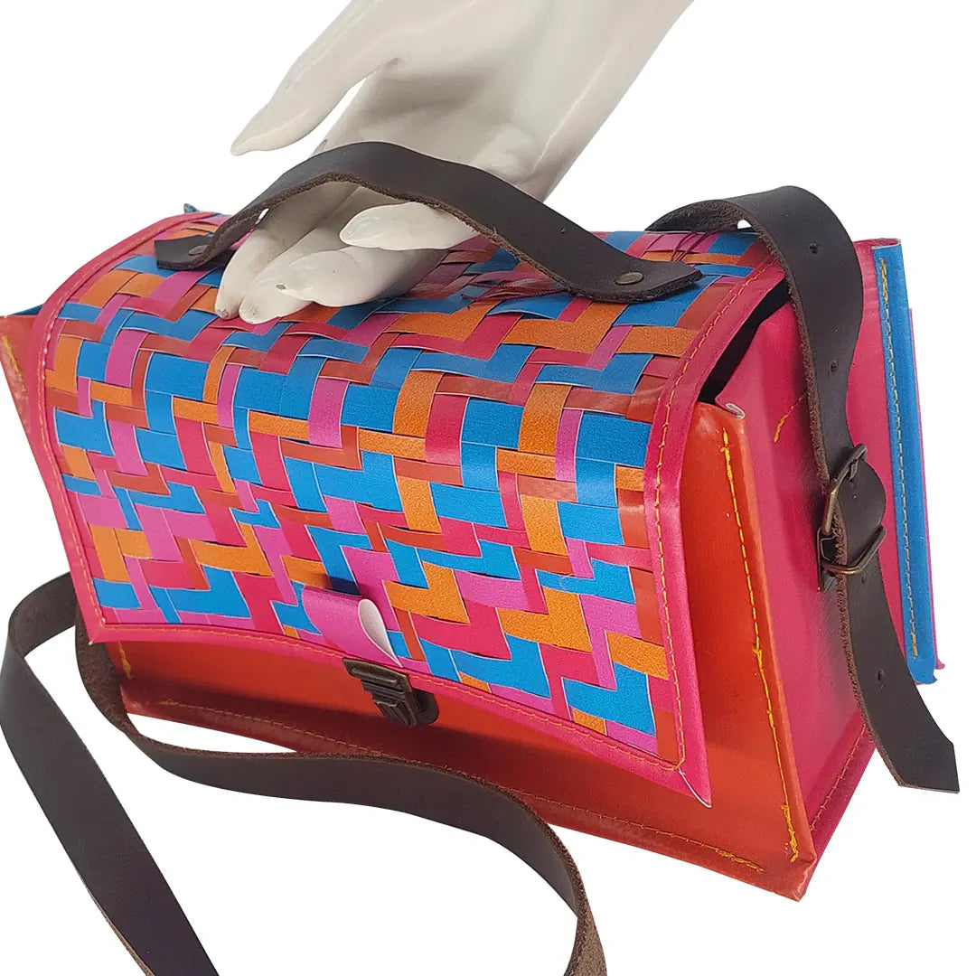 Alice Special Edition Bag 625 by ReCreate, a vibrant special edition bag in reclaimed advertising banner with woven flap and leather strap. - detail