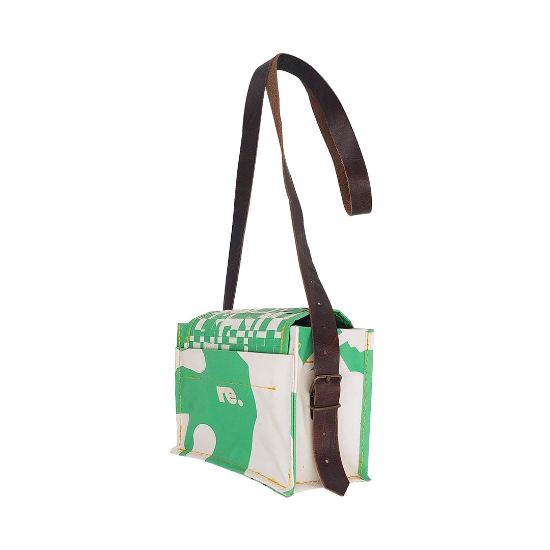 Anita Bag 224 Special Edition by ReCreate, a compact green bag in reclaimed advertising banner with woven flap and leather strap. - side