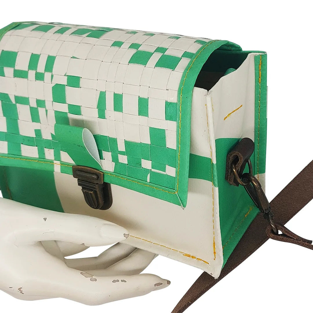 Anita Bag 224 Special Edition by ReCreate, a compact green bag in reclaimed advertising banner with woven flap and leather strap. - detail