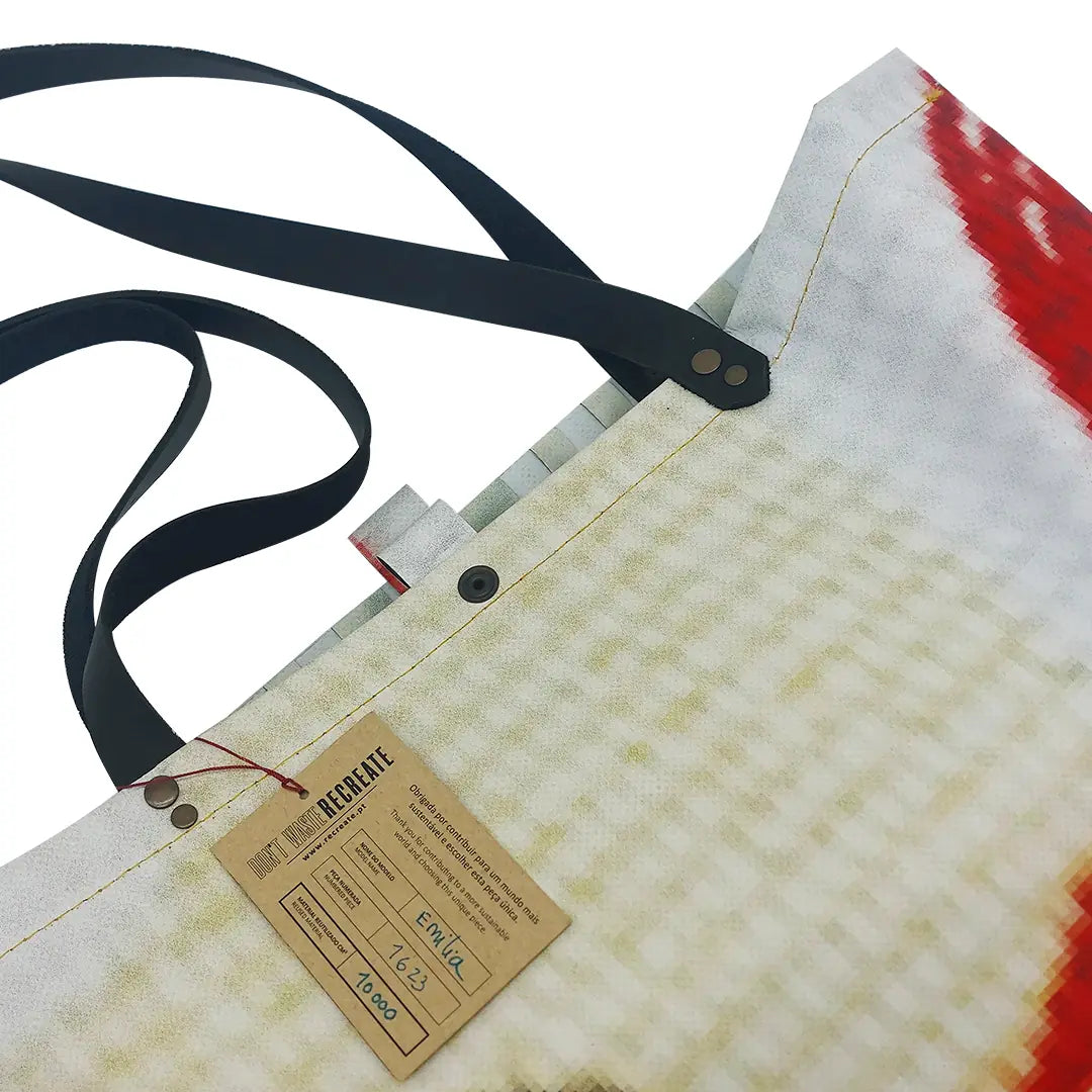 Emilia Bag 1623 by ReCreate, a large tote bag in reclaimed advertising banner with woven detail, leather straps and an interior pocket. - tag