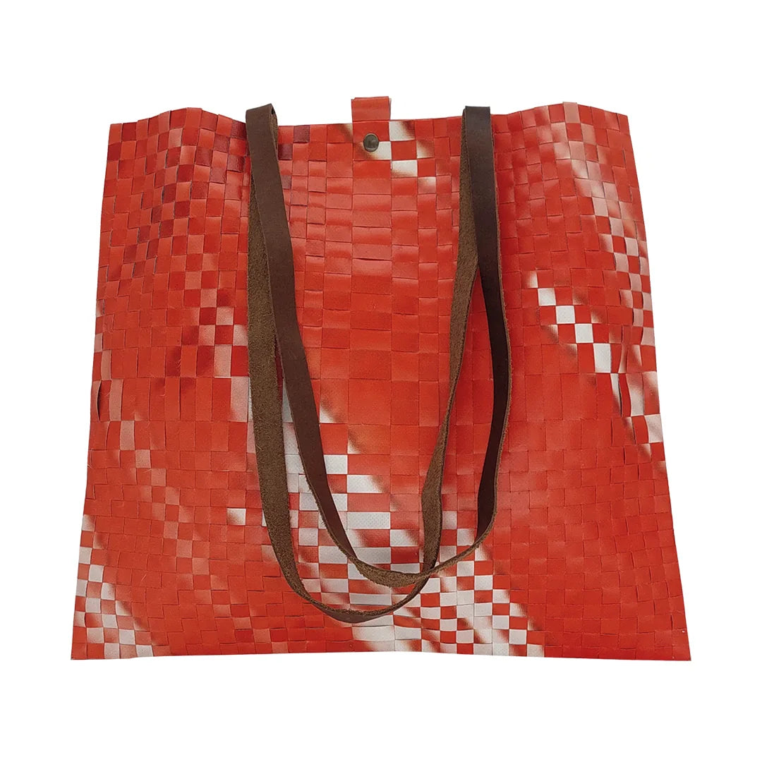 Emilia Bag 323 by ReCreate, a large tote bag in reclaimed advertising banner with one woven side, one smooth side and leather straps. -front