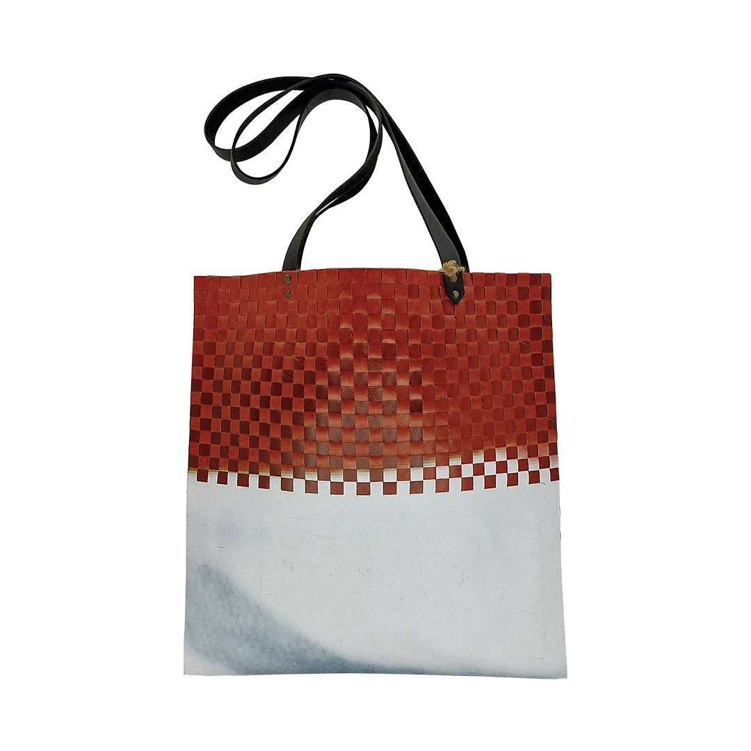 Inversa Bag 223 by ReCreate, a red and white tote in reclaimed advertising banner with inverted woven work, leather straps and one inner pocket. - back