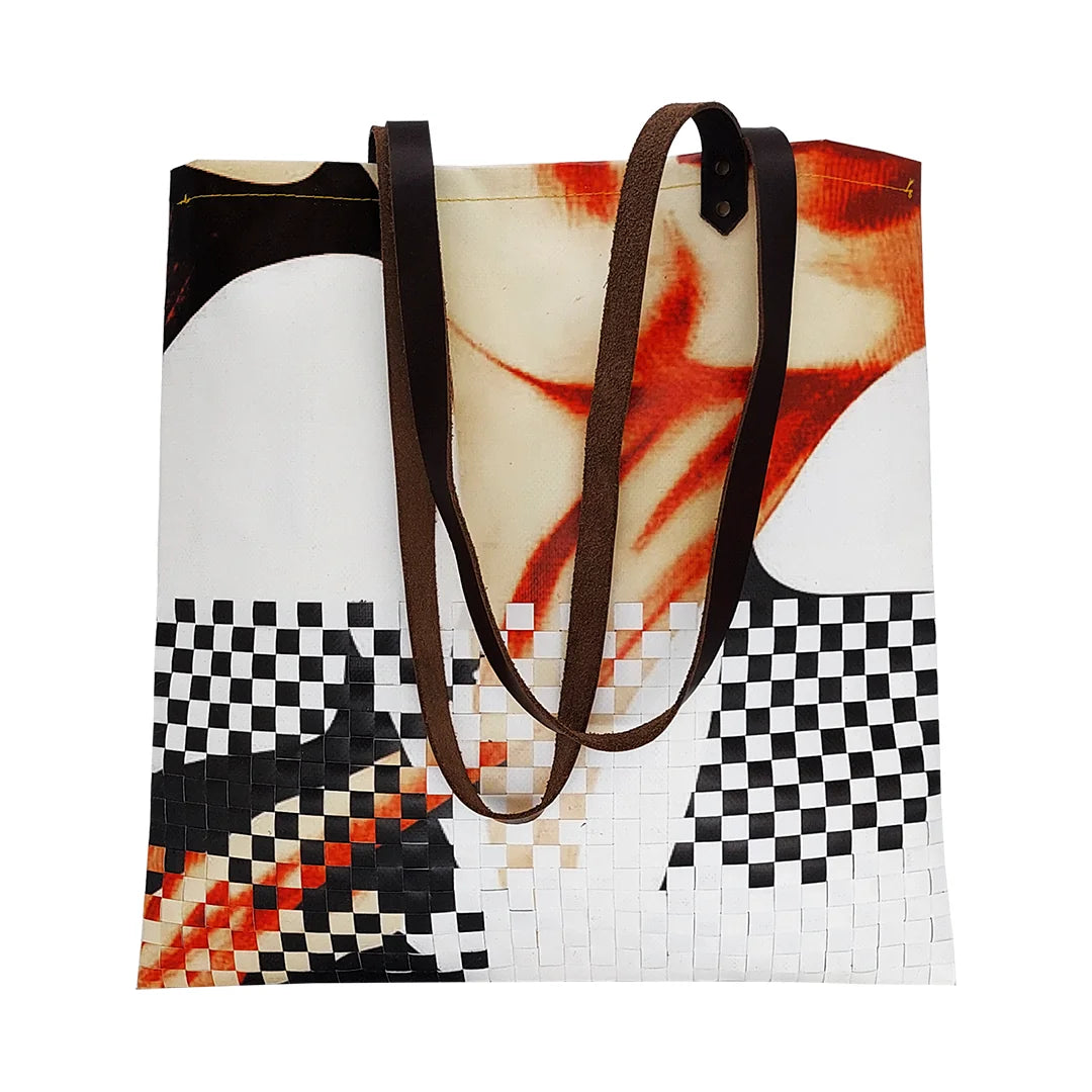 Inversa Bag 5723 by ReCreate, a graphic tote in reclaimed advertising banner with inverted weaving, leather straps and one inner pocket. - front