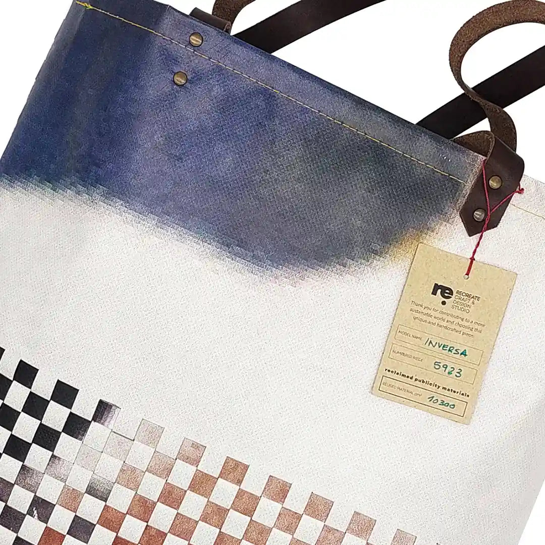 Inversa Bag 5923 by ReCreate, a tote in reclaimed advertising banner with inverted weaving, leather straps and one inner pocket. - tag