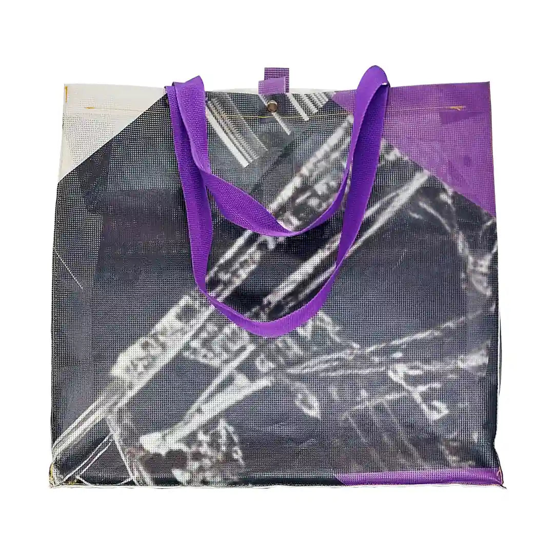 Júlia Bag 124 by ReCreate, made from micro-perforated reclaimed banner with five inner pockets and snap closures.-front