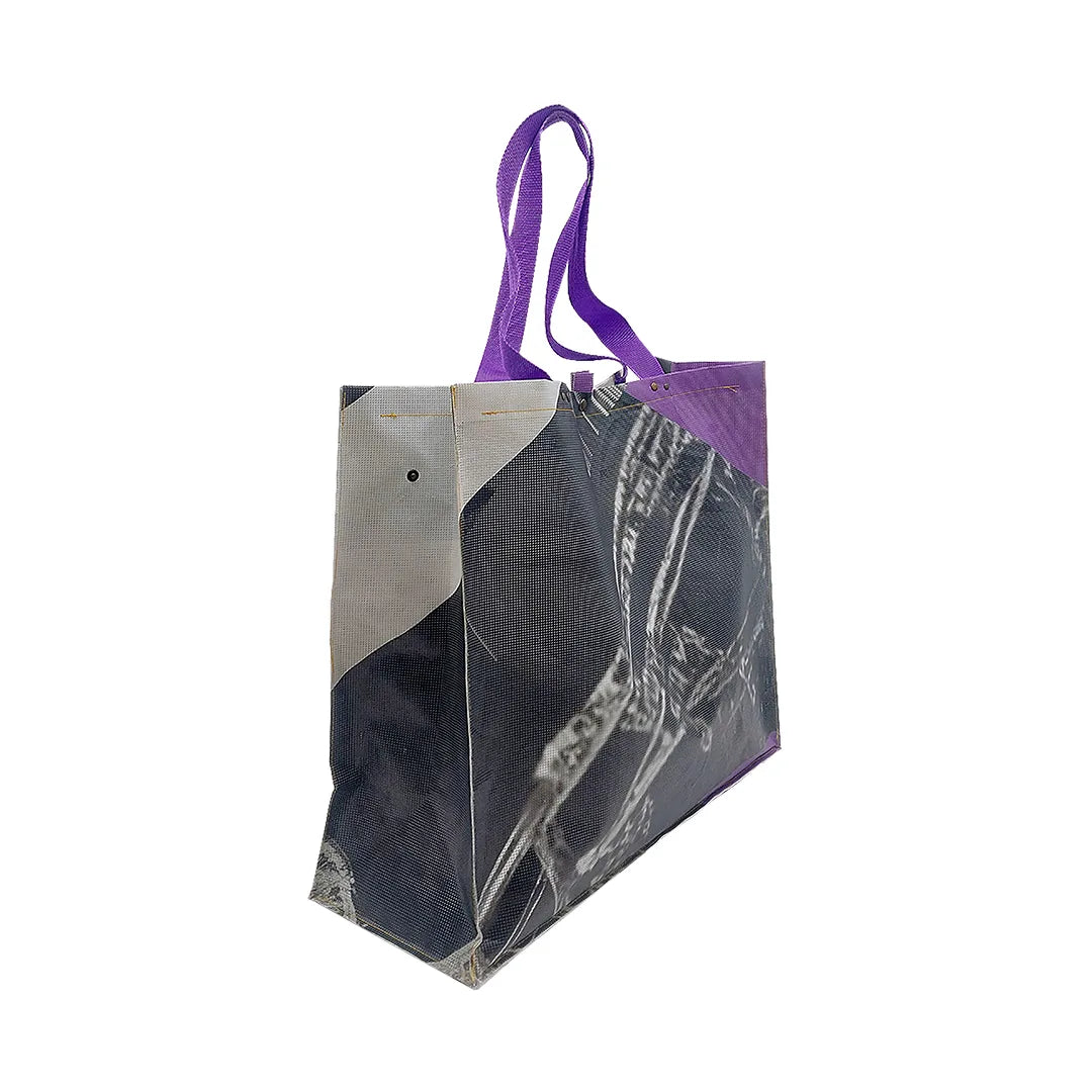 Júlia Bag 124 by ReCreate, made from micro-perforated reclaimed banner with five inner pockets and snap closures. - side 1