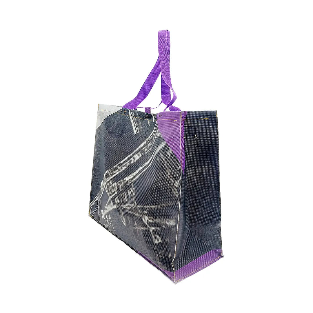 Júlia Bag 124 by ReCreate, made from micro-perforated reclaimed banner with five inner pockets and snap closures. - side 2