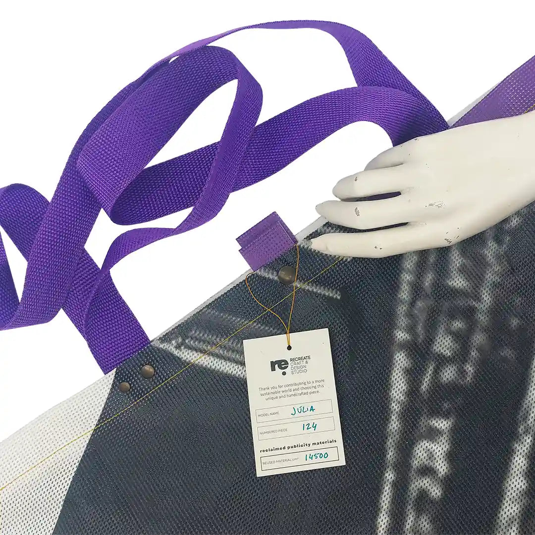 Júlia Bag 124 by ReCreate, made from micro-perforated reclaimed banner with five inner pockets and snap closures. - tag