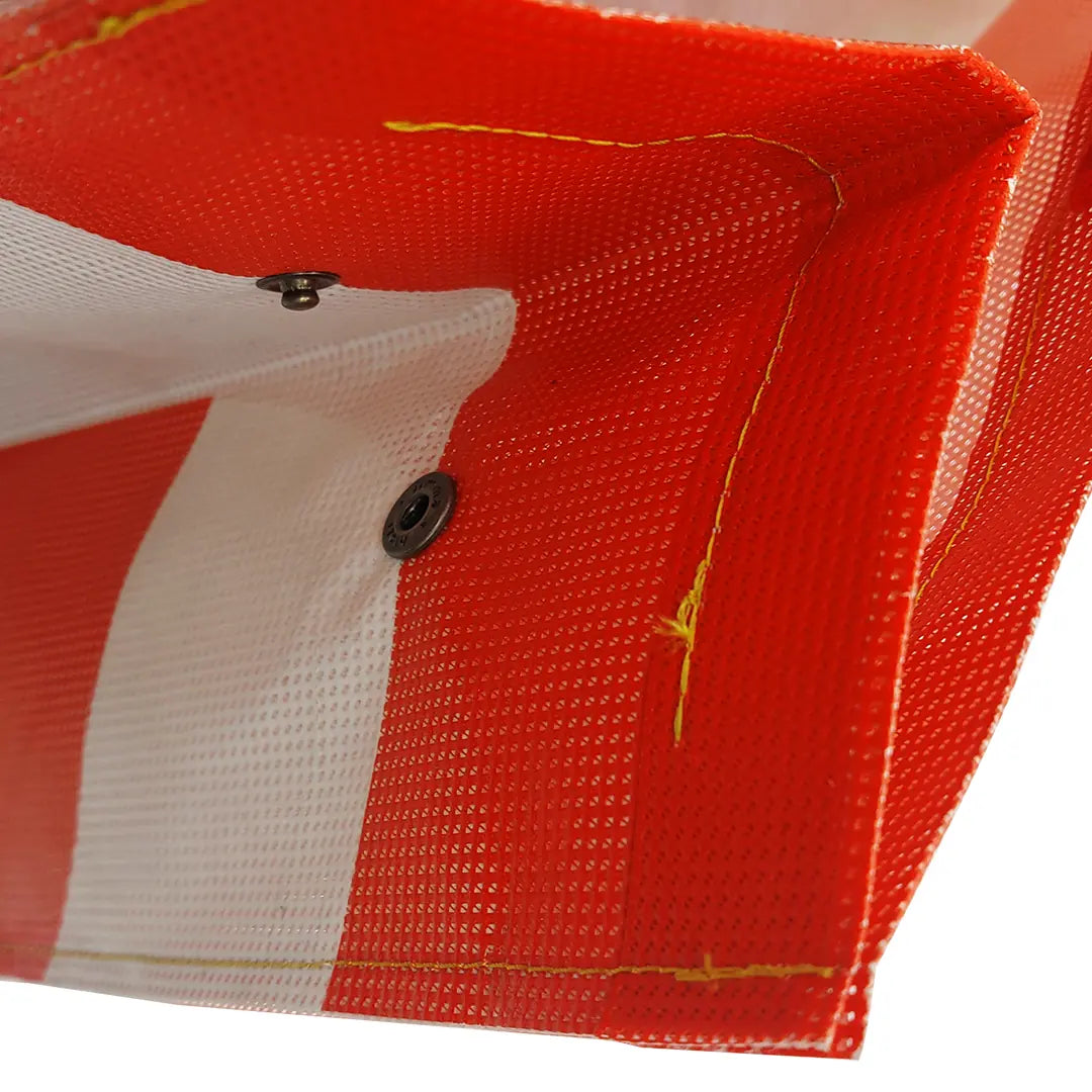 Júlia Bag 224 by ReCreate, a large red tote made from micro-perforated reclaimed banner with five inner pockets and snap closures. - detail