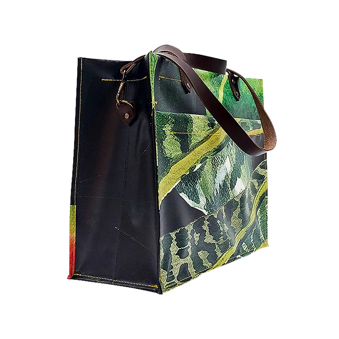 Julieta Bag 324 by ReCreate, a structured bag in reclaimed advertising banner with leather straps, zip closure and botanical graphic presence. - side