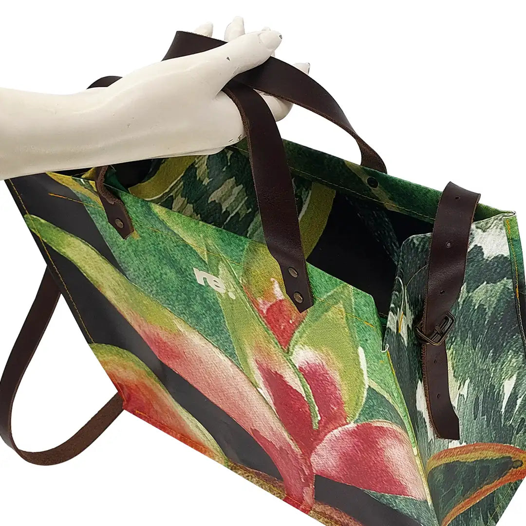 Julieta Bag 324 by ReCreate, a structured bag in reclaimed advertising banner with leather straps, zip closure and botanical graphic presence. - handle