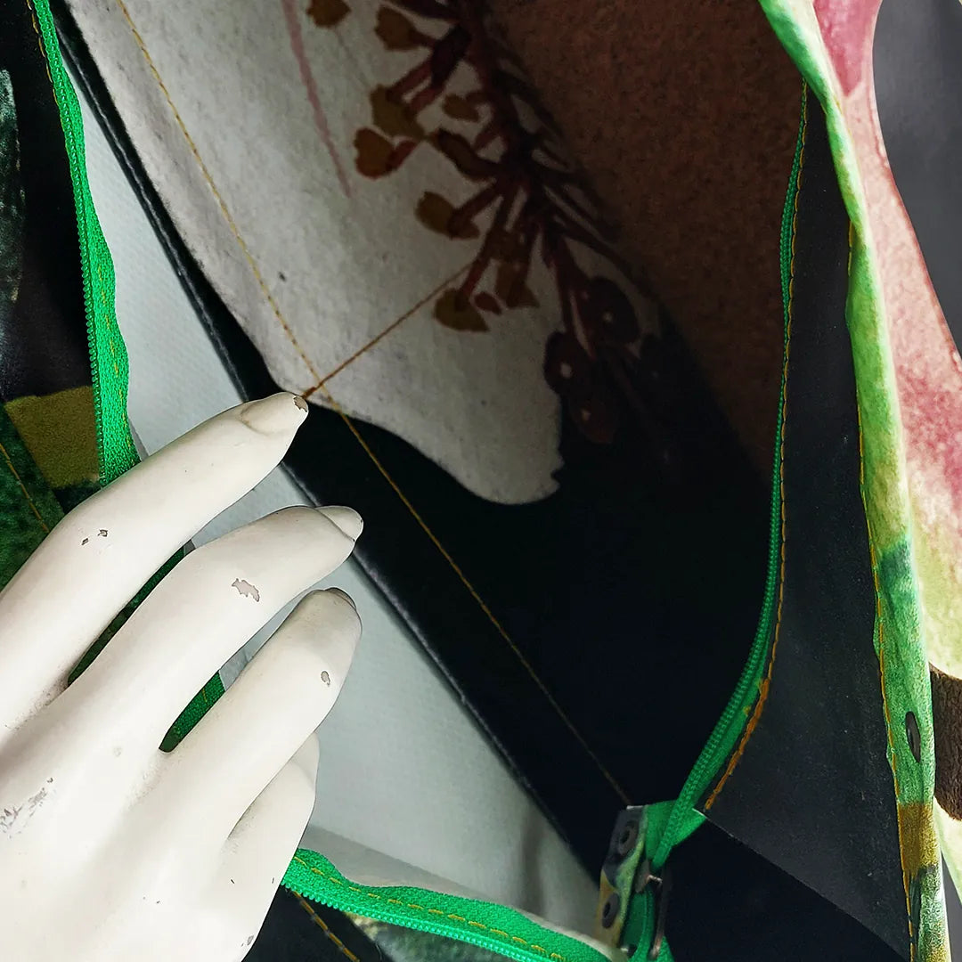 Julieta Bag 324 by ReCreate, a structured bag in reclaimed advertising banner with leather straps, zip closure and botanical graphic presence. - pocket