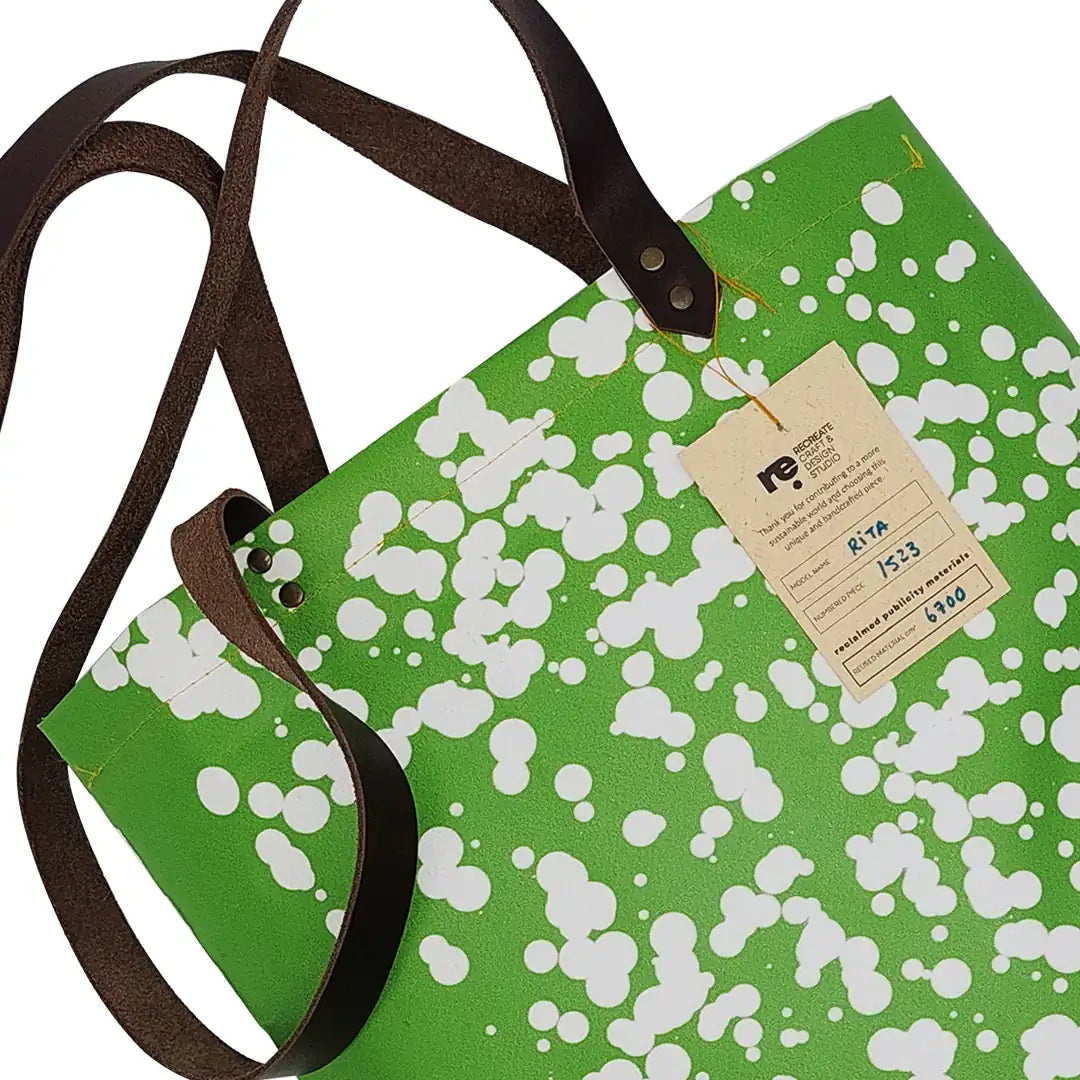 Rita Bag 1523 by ReCreate, a green tote in reclaimed advertising banner with leather straps, woven texture and one inner pocket. - tag