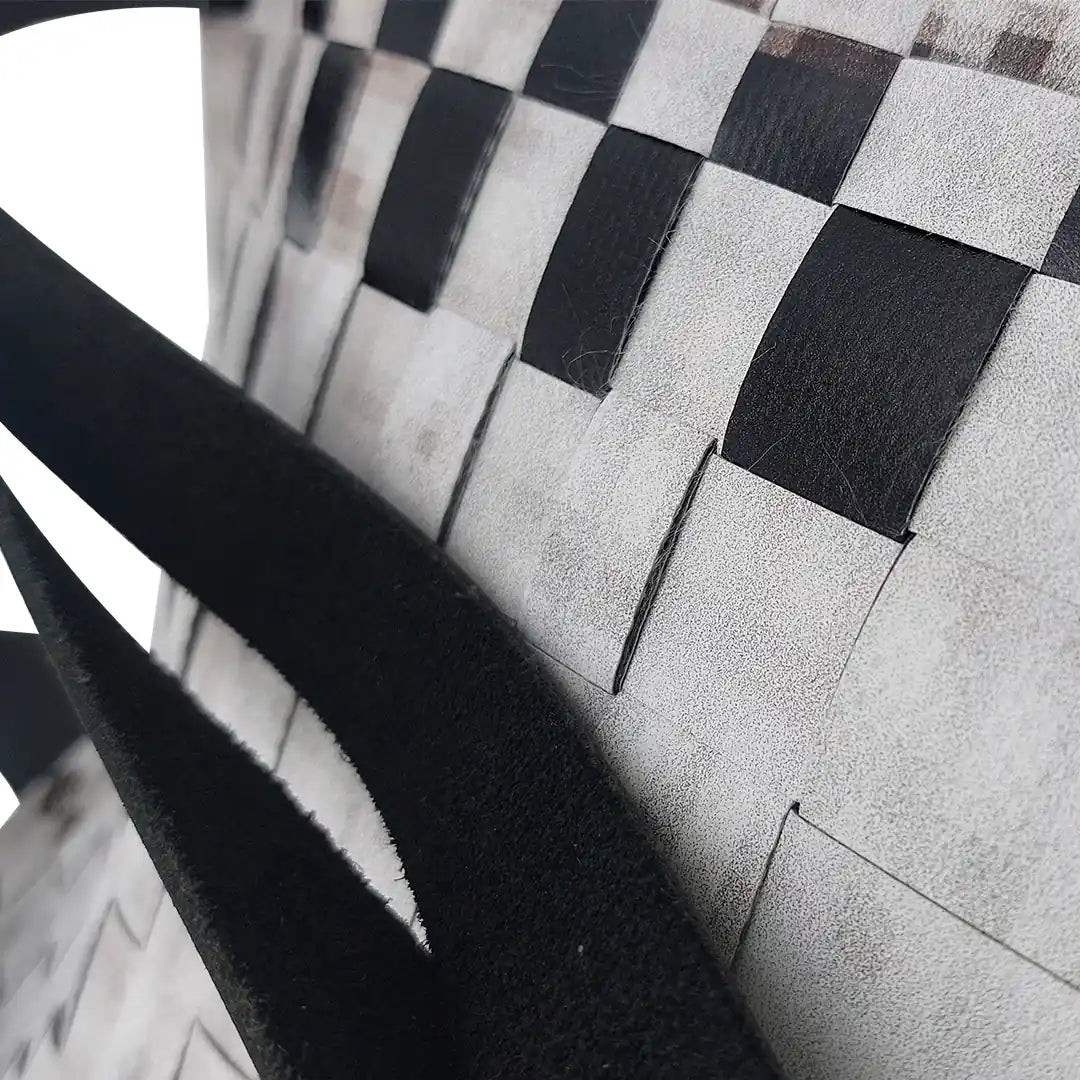 Rita Bag 1623 by ReCreate, a pale woven tote in reclaimed advertising banner with black leather straps and one inner pocket. - detail
