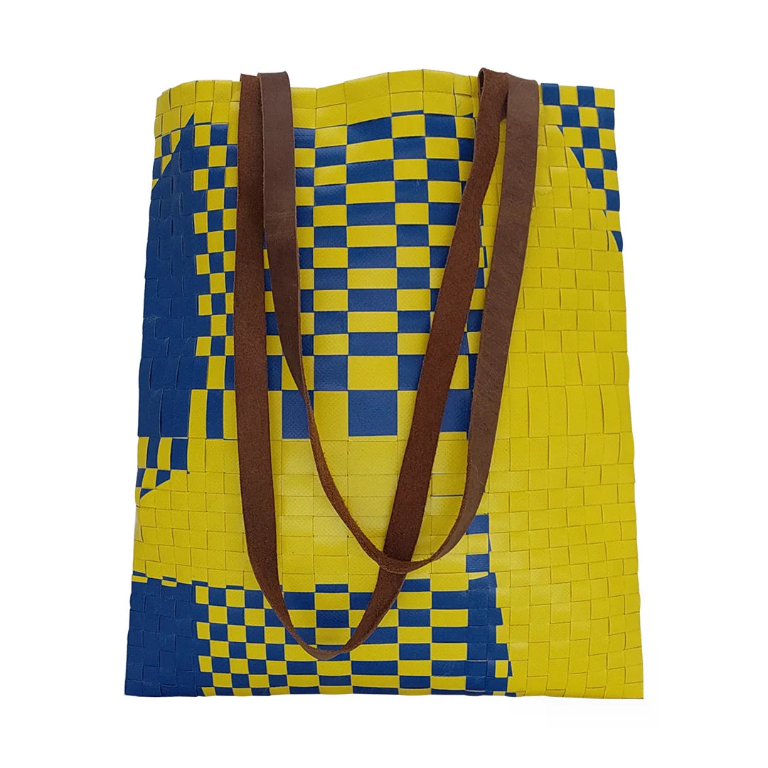 Rita Bag 1723 by ReCreate, a yellow and blue tote in reclaimed advertising banner with woven front, leather straps and one inner pocket. - front