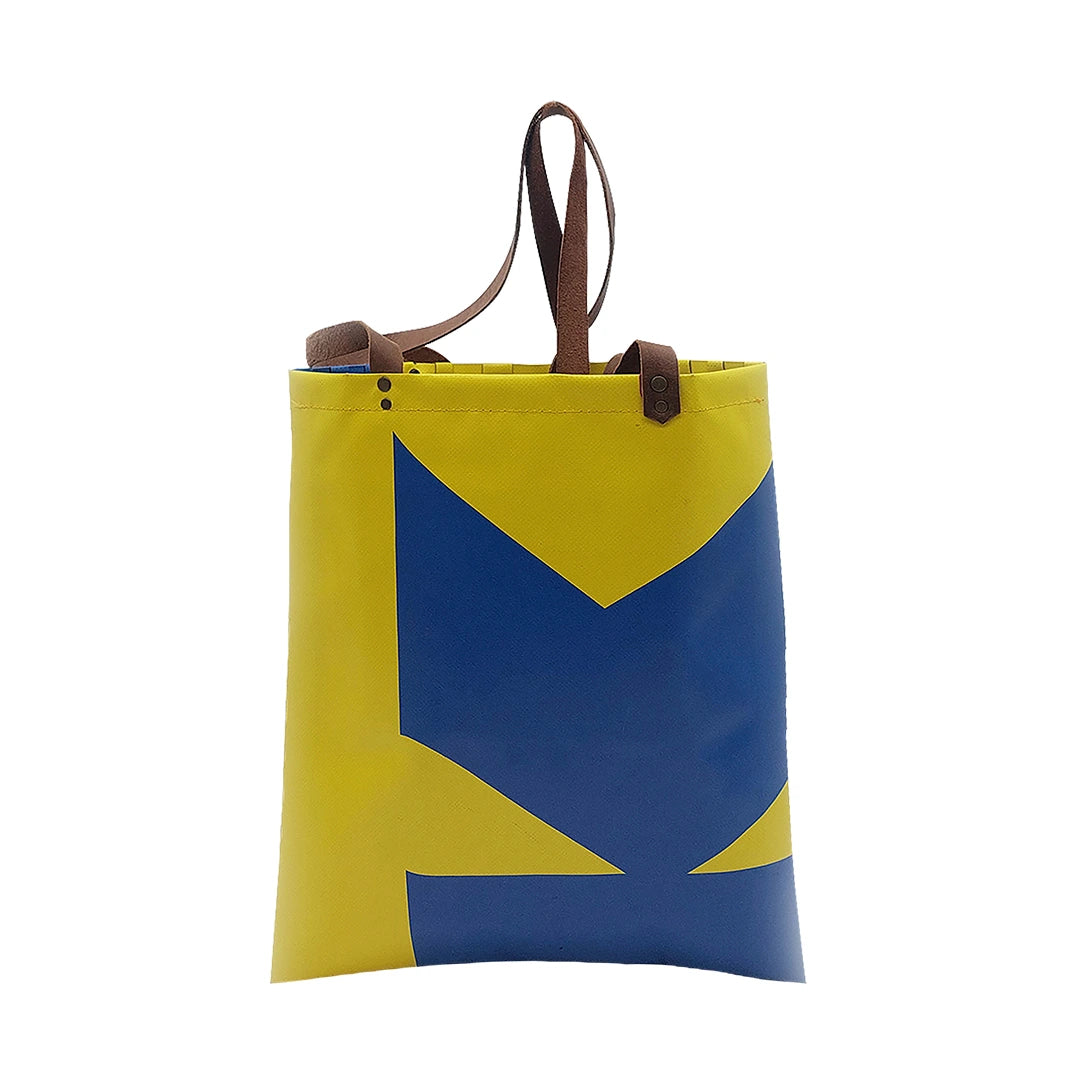 Rita Bag 1723 by ReCreate, a yellow and blue tote in reclaimed advertising banner with woven front, leather straps and one inner pocket. - back