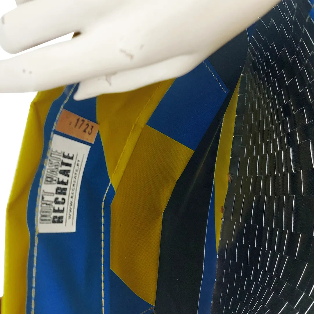 Rita Bag 1723 by ReCreate, a yellow and blue tote in reclaimed advertising banner with woven front, leather straps and one inner pocket. - pocket