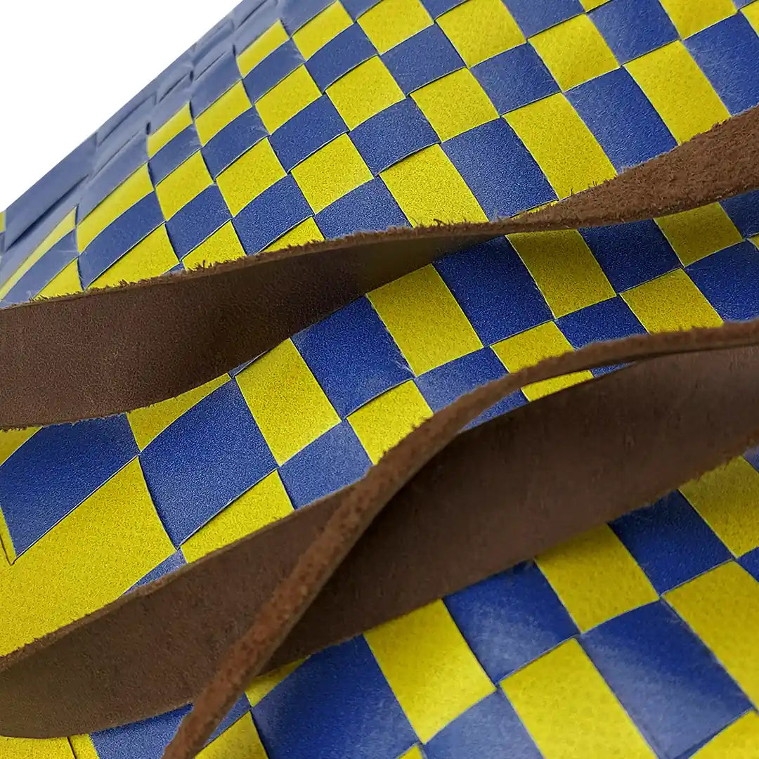 Rita Bag 1723 by ReCreate, a yellow and blue tote in reclaimed advertising banner with woven front, leather straps and one inner pocket. - detail