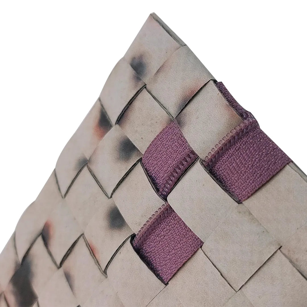 Slim one-of-a-kind pouch made from reused advertising material, with a dusty purple zip and handwoven back detail. -zipper detail