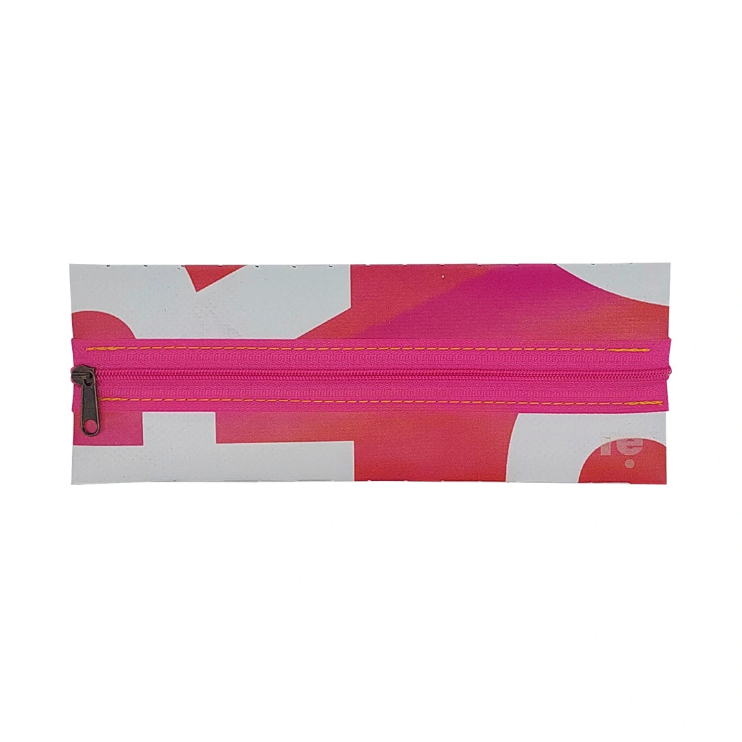 Bright one-of-a-kind pouch made from reused advertising material, with pink zip detail and handwoven graphic back. - front