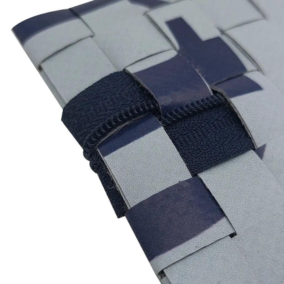 Slim pouch made from reclaimed advertising banner in soft blue and navy tones, ideal for pens, cables and everyday essentials. - detail