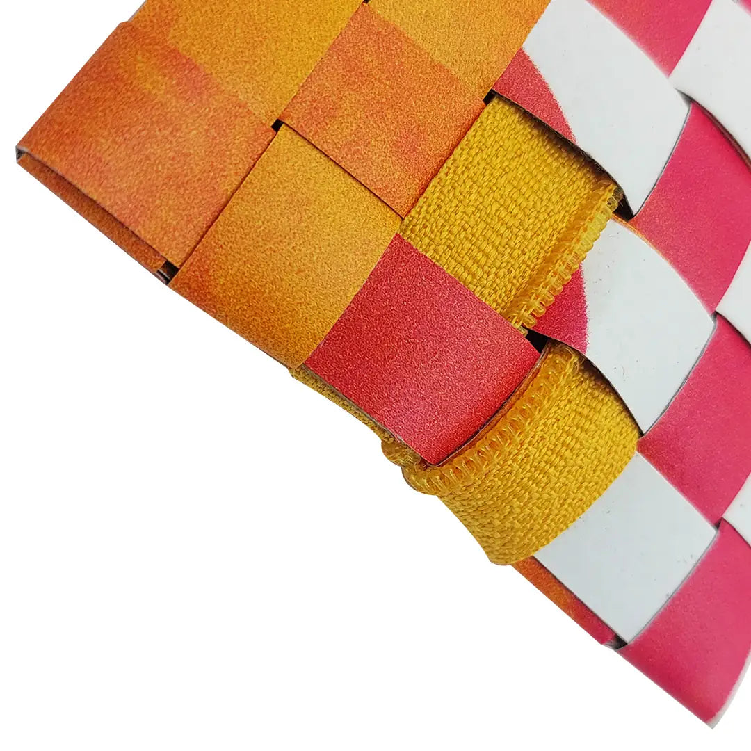 Compact banner pouch in yellow, orange and pink tones, made for pens, cables and small everyday items with a distinctive woven reverse. - detail