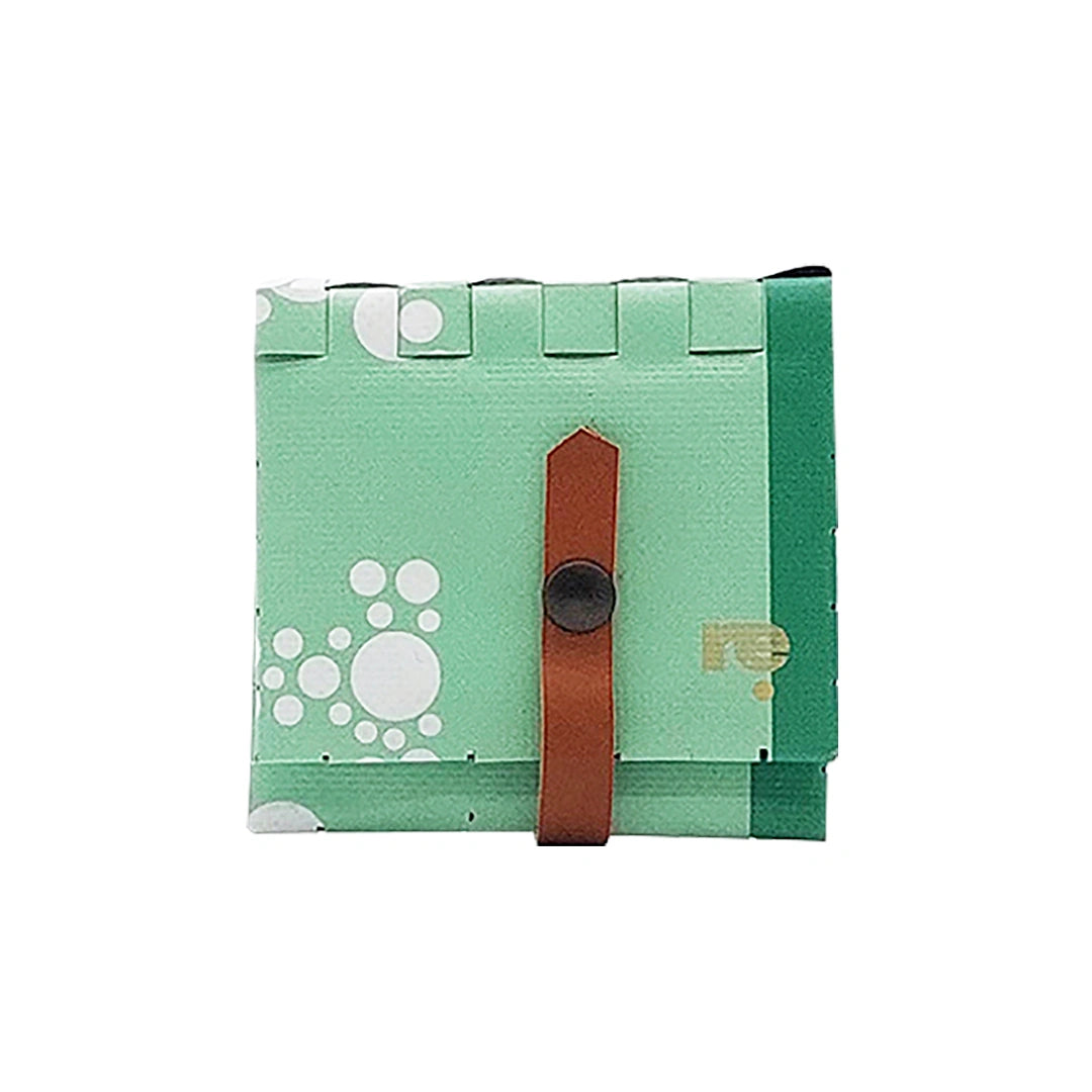 John Wallet 17723 by ReCreate is a mint-green reclaimed-banner wallet with white graphic circles, made to hold up to 8 cards and coins. - front