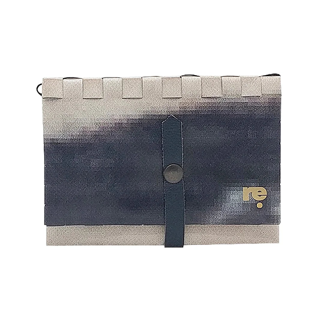 Katie Wallet 2323 by ReCreate uses reclaimed advertising banner in grey-black tones, with space for documents, money and a small notebook.- front