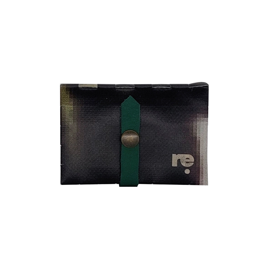 Compact one-of-a-kind wallet made from reused advertising material, designed to hold up to 6 cards and coins.- front