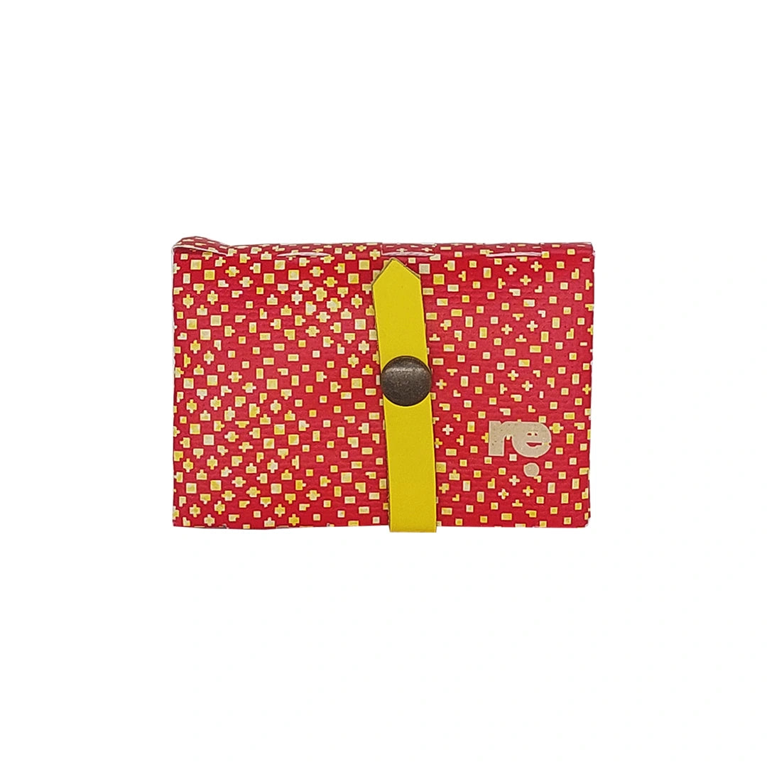 Peter Wallet 2125 by ReCreate is a red reclaimed-banner wallet with yellow graphic detail, designed to hold up to 6 cards and coins. - front