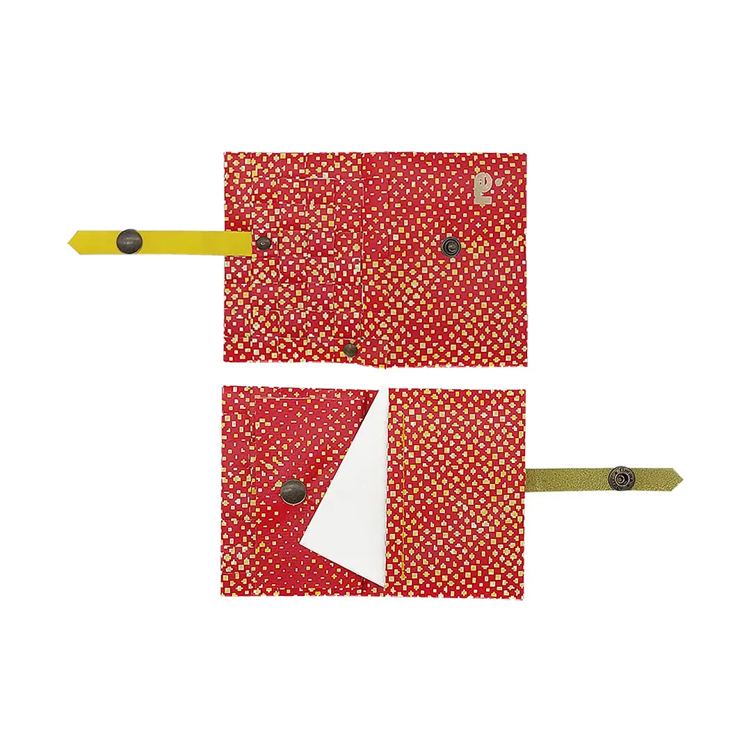 Peter Wallet 2125 by ReCreate is a red reclaimed-banner wallet with yellow graphic detail, designed to hold up to 6 cards and coins. - both sides