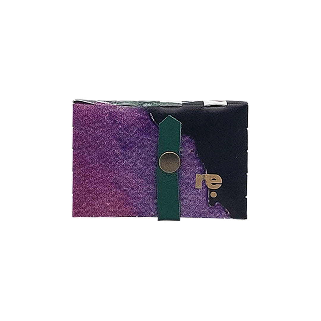 Peter Wallet 725 is a ReCreate wallet made from reclaimed advertising banner, with woven green details, coin space and room for up to 6 cards. - front